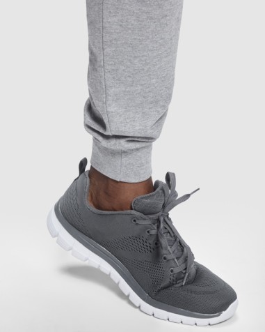 Long skinny trousers with cuffs at...