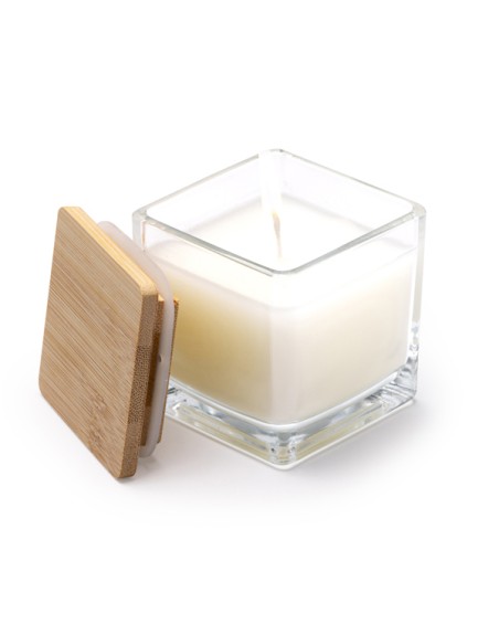 Candle in a customizable glass container with vanilla scent Candle in a customizable glass container with vanilla scent